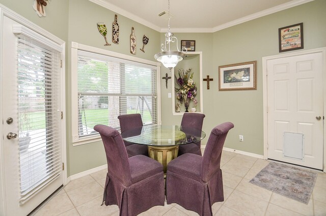 1511 Baldridge Ln, Katy, TX 77494 - dining area with light tile patterned floors, ornamental molding, and baseboards
