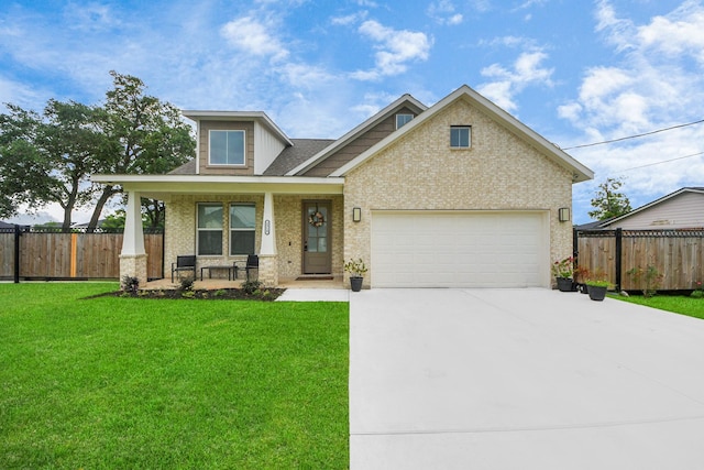2310 Lomax Dr, La Porte, TX 77571 - craftsman house featuring covered porch, concrete driveway, an attached garage, and brick siding
