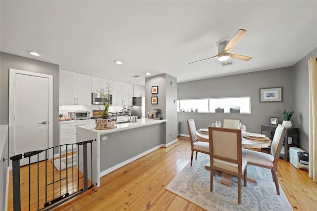 1716 W Dallas St Unit 11, Houston, TX 77019 - dining space featuring a ceiling fan, light wood-style flooring, recessed lighting, and baseboards