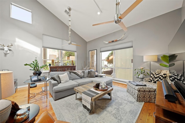 1716 W Dallas St Unit 11, Houston, TX 77019 - living area featuring ceiling fan, high vaulted ceiling, and light wood-style floors