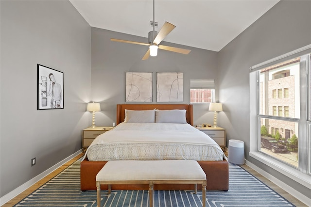 1716 W Dallas St Unit 11, Houston, TX 77019 - bedroom featuring baseboards, wood finished floors, and high vaulted ceiling
