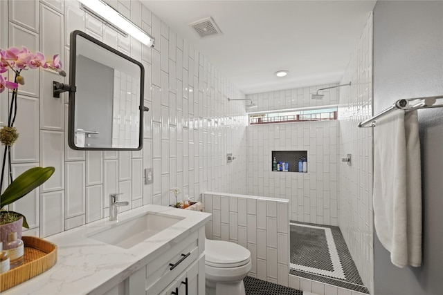 1716 W Dallas St Unit 11, Houston, TX 77019 - bathroom featuring walk in shower, vanity, toilet, and tile patterned flooring