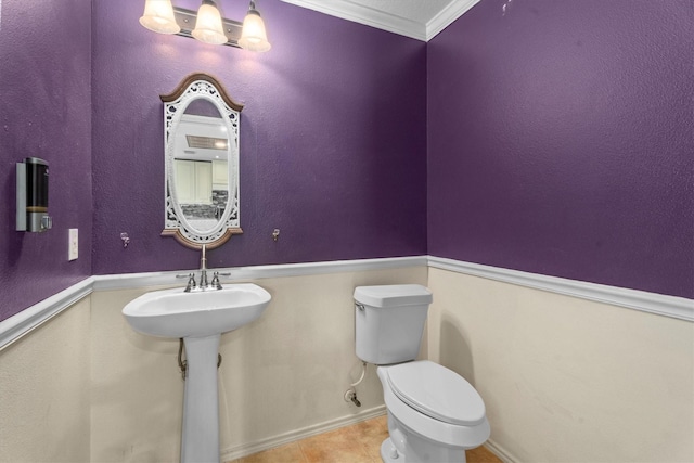 1910 Serenata Ln, Humble, TX 77396 - bathroom with toilet, tile patterned floors, and crown molding