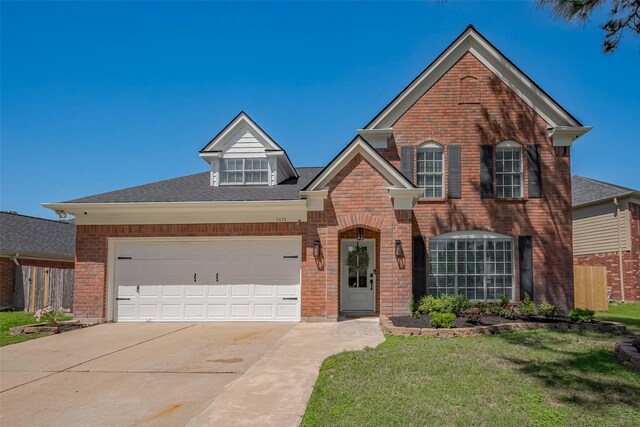 5615 Haven Point Dr, Houston, TX 77084 - traditional-style house with brick siding, driveway, a garage, and roof with shingles