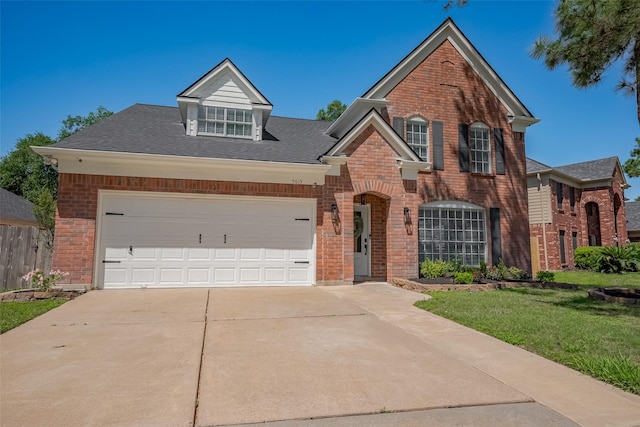 5615 Haven Point Dr, Houston, TX 77084 - traditional-style house with brick siding, concrete driveway, an attached garage, and roof with shingles
