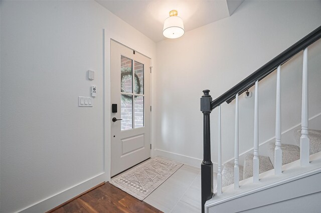 5615 Haven Point Dr, Houston, TX 77084 - foyer featuring stairs, baseboards, and dark wood-style flooring