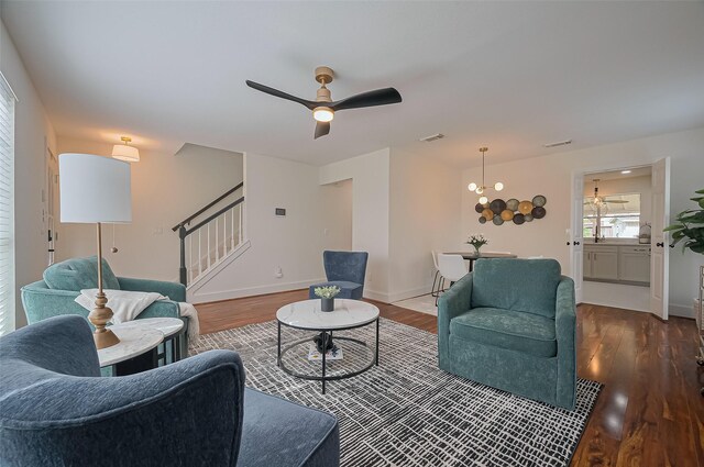 5615 Haven Point Dr, Houston, TX 77084 - living room with stairs, wood finished floors, a ceiling fan, and baseboards