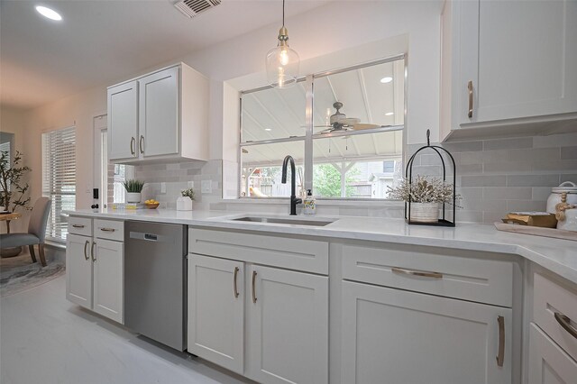 5615 Haven Point Dr, Houston, TX 77084 - kitchen with dishwasher, a sink, decorative backsplash, light countertops, and recessed lighting