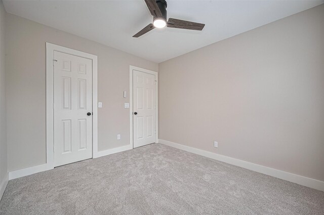 5615 Haven Point Dr, Houston, TX 77084 - unfurnished bedroom with carpet, baseboards, and ceiling fan