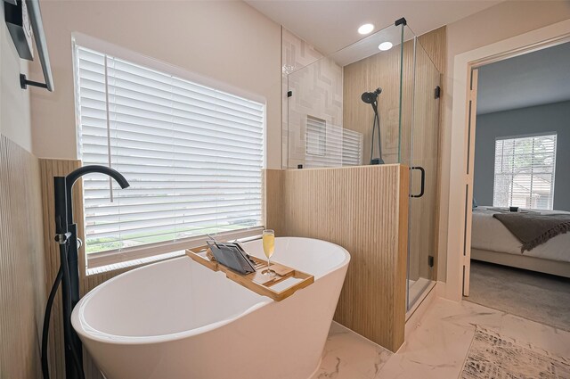 5615 Haven Point Dr, Houston, TX 77084 - bathroom with a shower stall, a freestanding tub, marble finish floors, recessed lighting, and ensuite bathroom