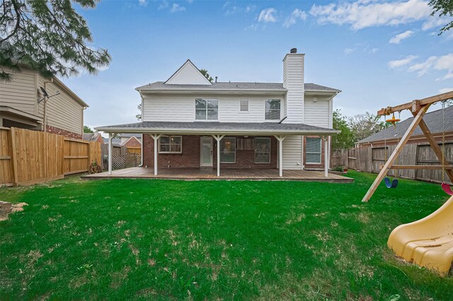 5615 Haven Point Dr, Houston, TX 77084 - back of house with a chimney, a playground, brick siding, and a patio