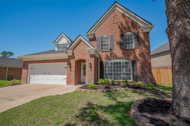 5615 Haven Point Dr, Houston, TX 77084 - traditional-style house with brick siding, driveway, and an attached garage