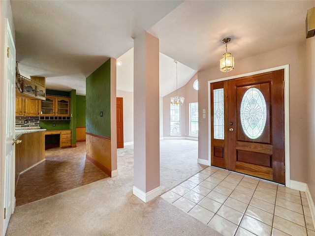 1507 N 24th St, Nederland, TX 77627 - foyer entrance featuring a chandelier, light carpet, lofted ceiling, and baseboards