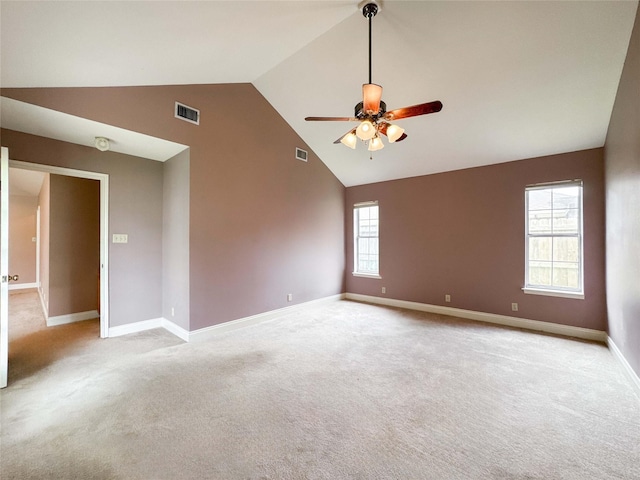 1507 N 24th St, Nederland, TX 77627 - spare room featuring ceiling fan, light carpet, baseboards, and high vaulted ceiling
