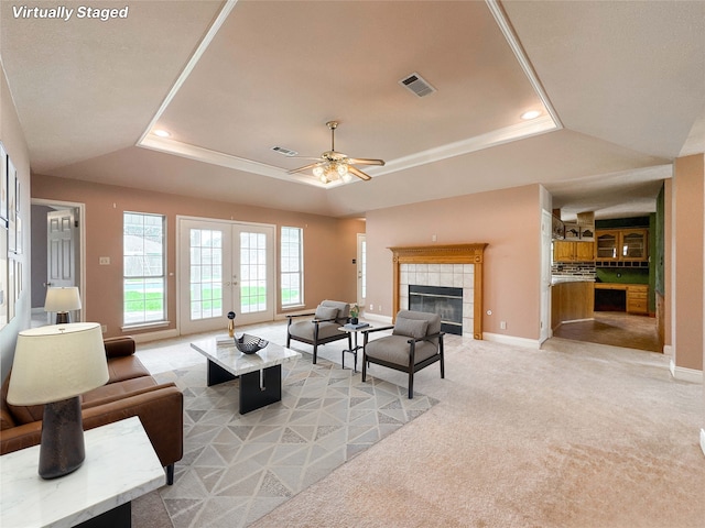 1507 N 24th St, Nederland, TX 77627 - living area featuring a tray ceiling, light carpet, french doors, recessed lighting, and baseboards