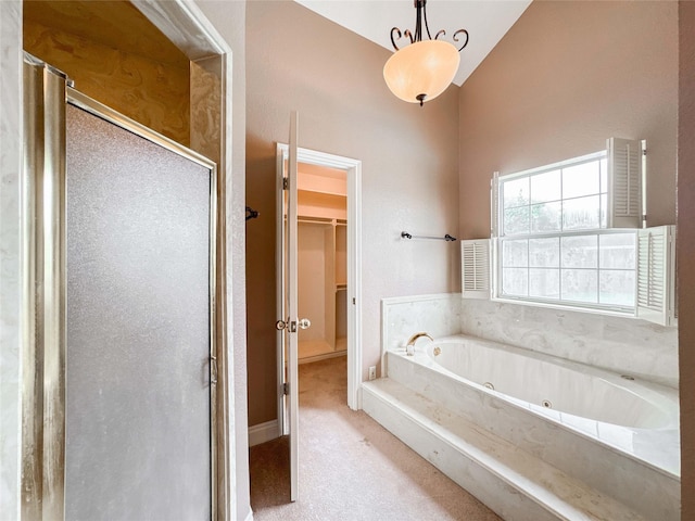 1507 N 24th St, Nederland, TX 77627 - bathroom with a stall shower, a jetted tub, a walk in closet, and high vaulted ceiling