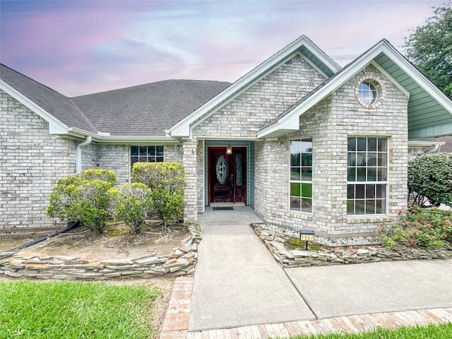 1507 N 24th St, Nederland, TX 77627 - view of front facade with roof with shingles and brick siding
