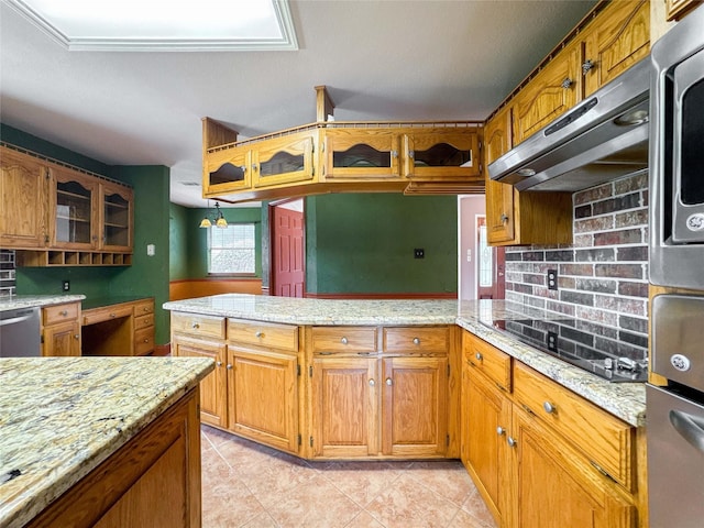 1507 N 24th St, Nederland, TX 77627 - kitchen featuring under cabinet range hood, appliances with stainless steel finishes, a peninsula, backsplash, and brown cabinetry