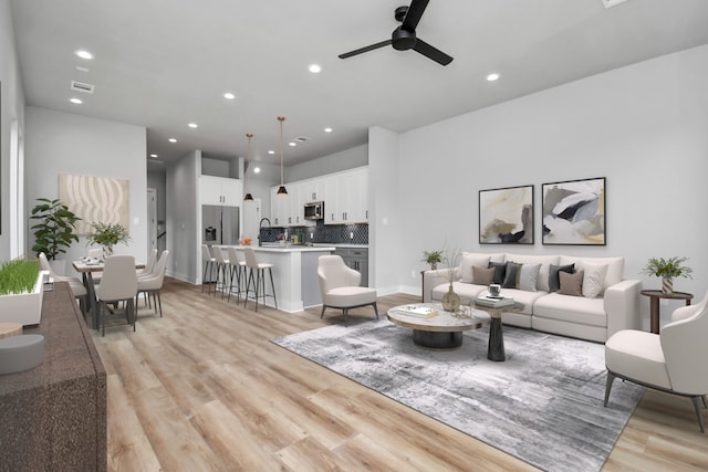 6817 Peerless St, Houston, TX 77021 - living area featuring a ceiling fan, light wood-style flooring, and recessed lighting