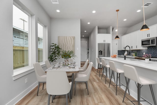 6817 Peerless St, Houston, TX 77021 - dining room with light wood-style floors and recessed lighting