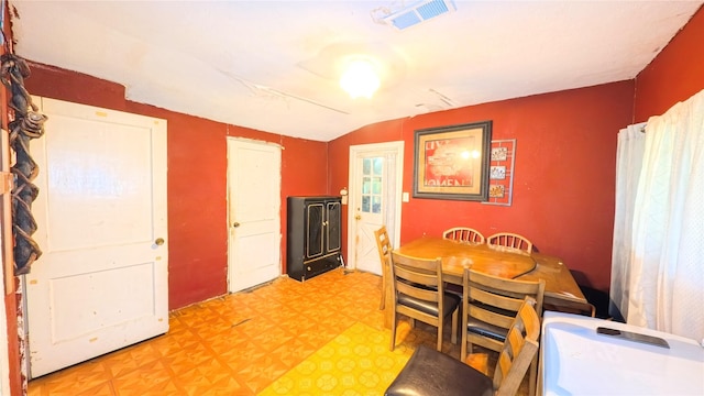 102 Jasmine St, Lake Jackson, TX 77566 - dining room with vaulted ceiling and light floors