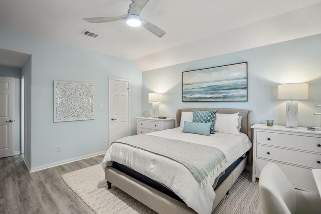2703 Jackson St, Houston, TX 77004 - bedroom featuring light wood-style floors, baseboards, vaulted ceiling, and a ceiling fan