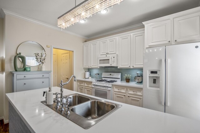 2703 Jackson St, Houston, TX 77004 - kitchen with white appliances, a sink, crown molding, backsplash, and light countertops