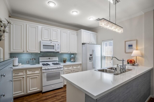 2703 Jackson St, Houston, TX 77004 - kitchen with white appliances, ornamental molding, a sink, backsplash, and a peninsula