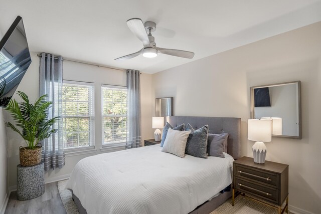 2703 Jackson St, Houston, TX 77004 - bedroom with baseboards, wood finished floors, and ceiling fan