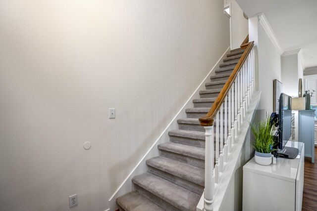 2703 Jackson St, Houston, TX 77004 - staircase featuring ornamental molding and wood finished floors