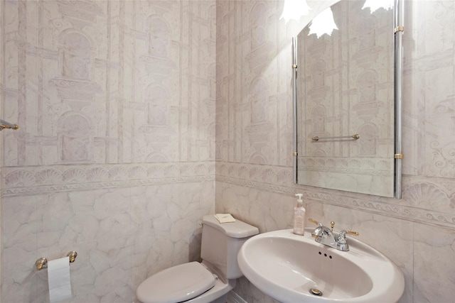 7123 Broadway St, Galveston, TX 77554 - bathroom featuring a sink, toilet, and tile walls