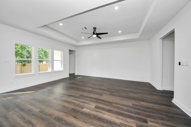 7430 Avenue E Ave E, Beasley, TX 77417 - unfurnished room with a raised ceiling, recessed lighting, ceiling fan, baseboards, and dark wood-type flooring