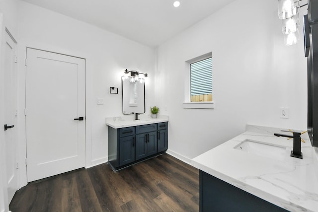 7430 Avenue E Ave E, Beasley, TX 77417 - full bathroom with double vanity, wood finished floors, recessed lighting, and baseboards