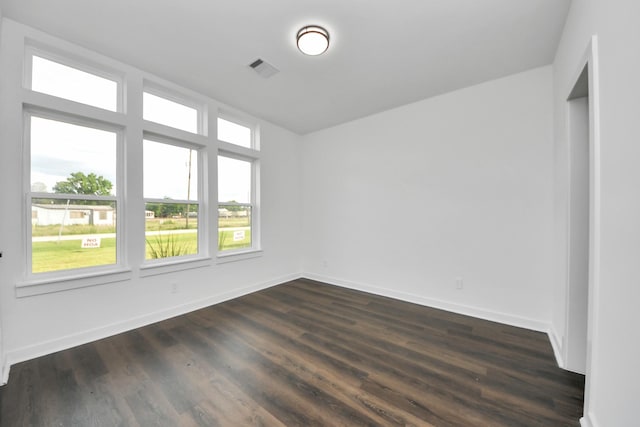7430 Avenue E Ave E, Beasley, TX 77417 - spare room featuring baseboards and dark wood-type flooring
