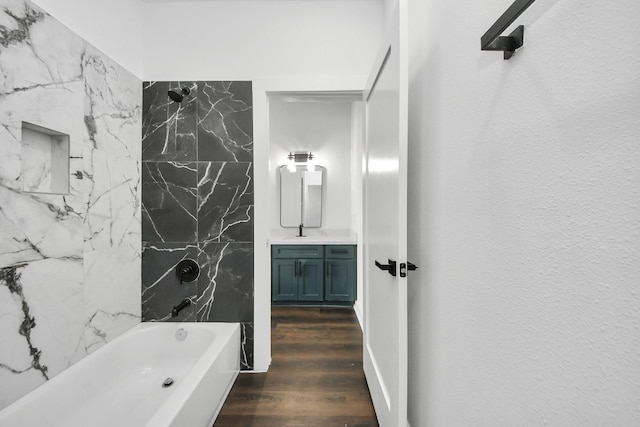 7430 Avenue E Ave E, Beasley, TX 77417 - full bath featuring vanity, tub / shower combination, and wood finished floors