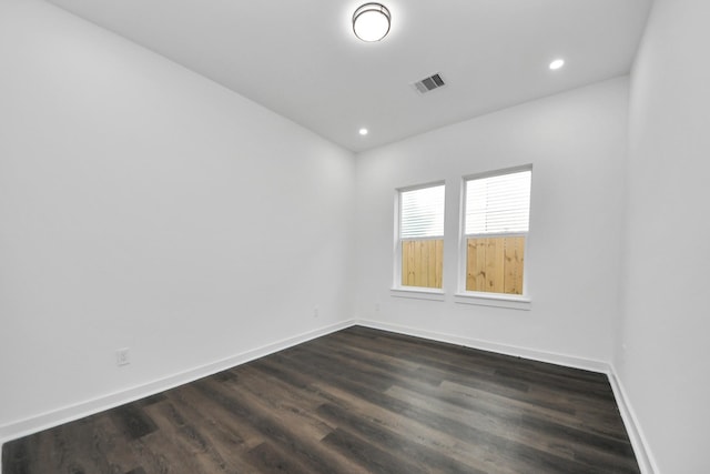 7430 Avenue E Ave E, Beasley, TX 77417 - unfurnished room with baseboards, dark wood finished floors, and recessed lighting