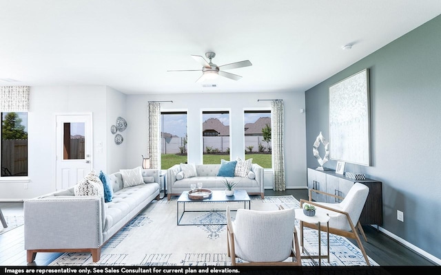 418 Riesling Dr, Alvin, TX 77511 - living area with wood finished floors, baseboards, and a ceiling fan