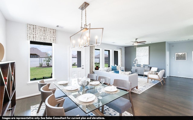 418 Riesling Dr, Alvin, TX 77511 - dining room with dark wood-style flooring, a chandelier, ceiling fan, and baseboards