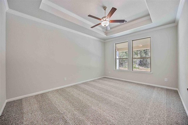 1497 Rd 66114, Dayton, TX 77535 - carpeted empty room featuring a raised ceiling, ornamental molding, and ceiling fan