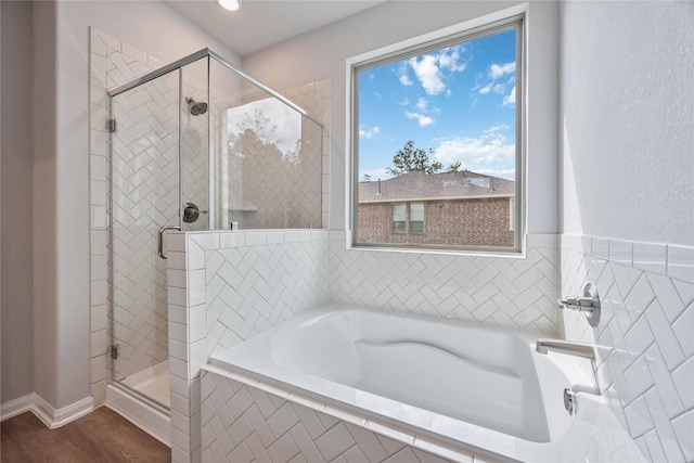 1497 Rd 66114, Dayton, TX 77535 - full bath with a shower stall, a garden tub, wood finished floors, and recessed lighting