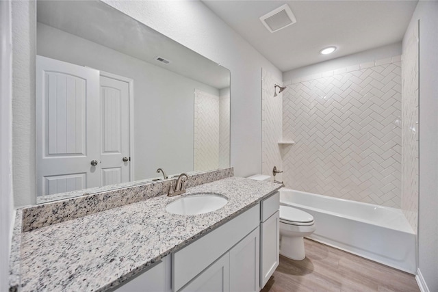 1497 Rd 66114, Dayton, TX 77535 - bathroom with vanity, bathtub / shower combination, and wood finished floors