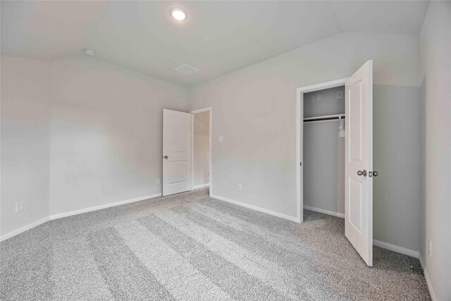 1497 Rd 66114, Dayton, TX 77535 - unfurnished bedroom with vaulted ceiling, carpet flooring, and a closet
