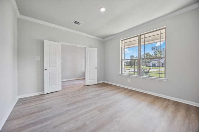 1497 Rd 66114, Dayton, TX 77535 - unfurnished bedroom featuring ornamental molding, light wood finished floors, and recessed lighting
