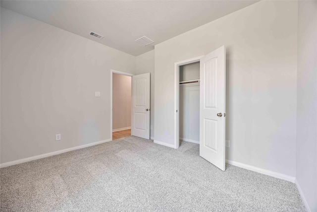 1497 Rd 66114, Dayton, TX 77535 - unfurnished bedroom with light carpet and a closet