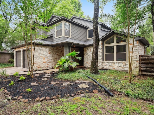 10 Leaf Trace Ct, The Woodlands, TX 77381 - view of front of home with stone siding and driveway