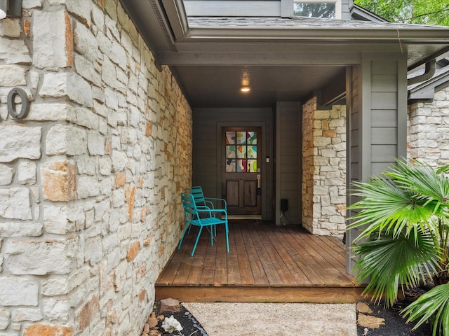 10 Leaf Trace Ct, The Woodlands, TX 77381 - doorway to property featuring stone siding and a porch