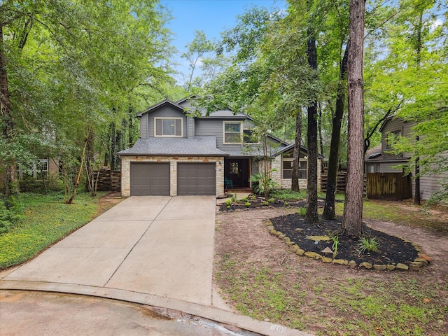 10 Leaf Trace Ct, The Woodlands, TX 77381 - view of front of property with an attached garage, driveway, and brick siding