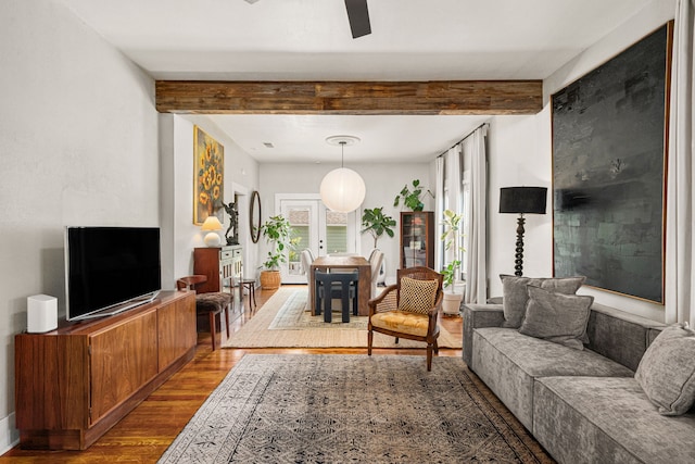1039 Louise St, Houston, TX 77009 - living area with wood finished floors, a ceiling fan, and beam ceiling