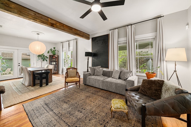 1039 Louise St, Houston, TX 77009 - living area with ceiling fan, wood finished floors, healthy amount of natural light, beam ceiling, and french doors