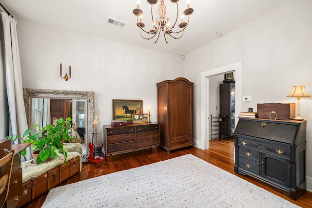 1039 Louise St, Houston, TX 77009 - bedroom with wood finished floors, a chandelier, and baseboards